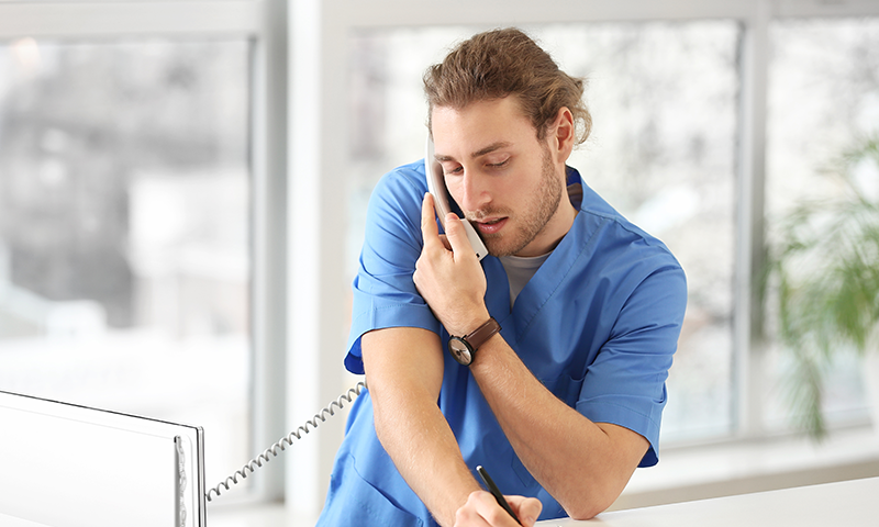 Credentialing -Male Nurse Answering Phone